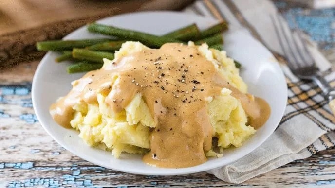 Mashed Potatoes And Creamy Golden Gravy